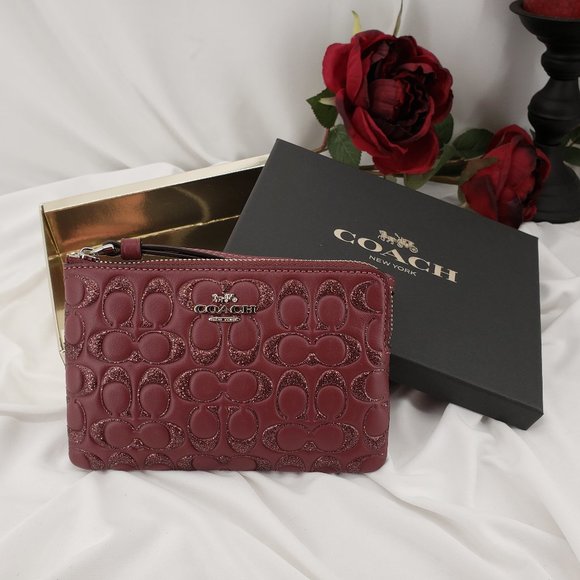 Coach Handbags - Coach Leather Corner Zip Wristlet in Wine color 🍷